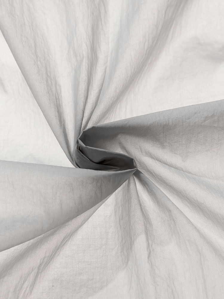 Close-up of water-proof nylon fabric used in Ultra-Light Multi-Pockets Windbreaker SF0895, showcasing durability and texture.